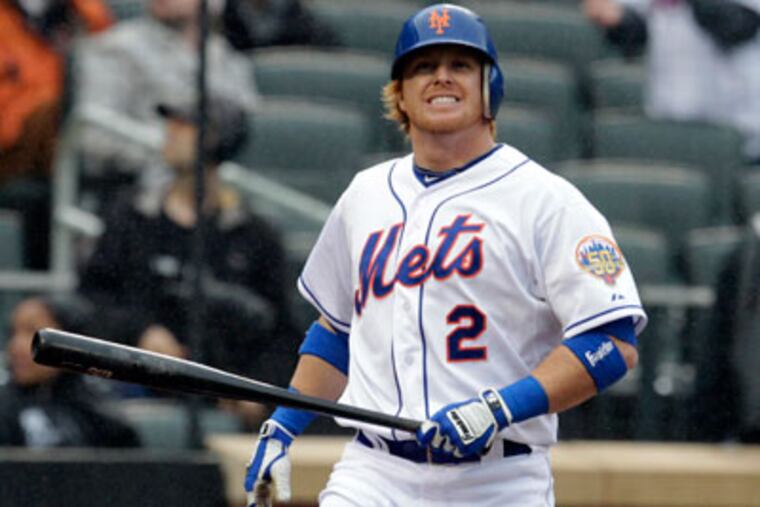 New York Mets' Justin Turner reacts during his last at-bat in the
ninth inning of a baseball game against the Miami Marlins, Thursday,
April 26, 2012, at Citi Field in New York. Turner was walked after
thirteen pitches and the Mets won 3-2. (AP Photo/Seth Wenig)