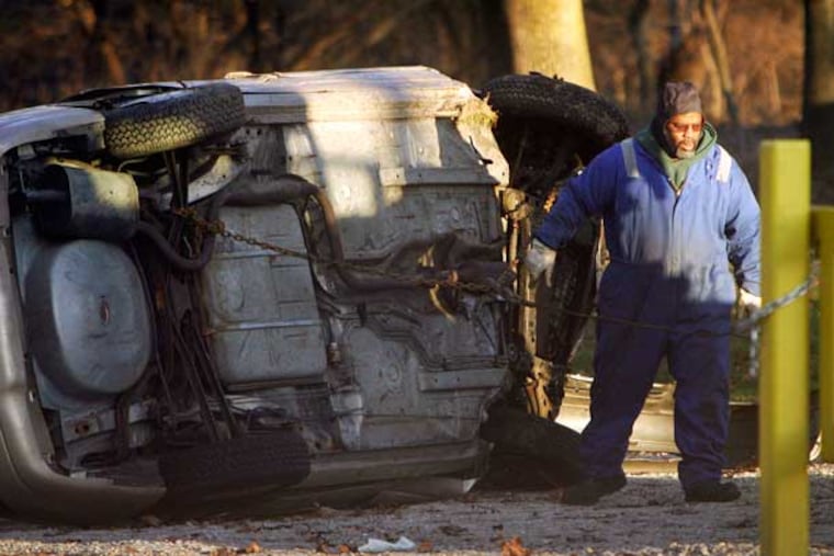 An overturned car on the Cobbs Creek Parkway in Southwest Philadelphia. Safety improvements for the parkway are included in a House bill passed Thursday.