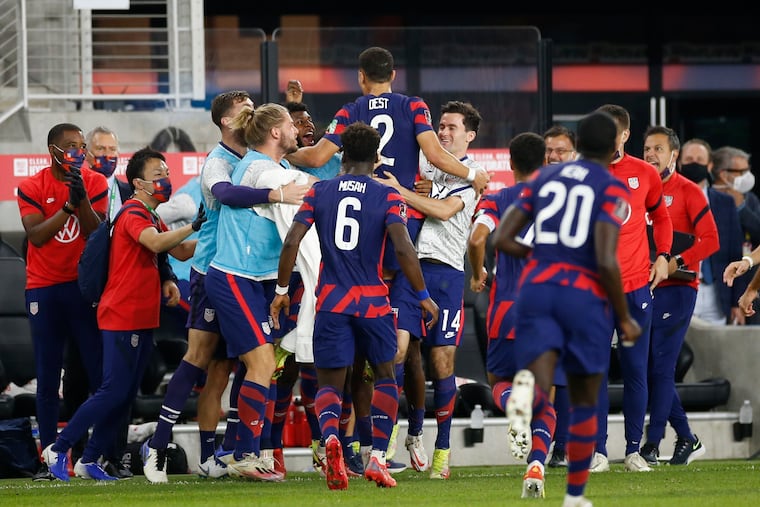Sergino Dest (2) celebrates his goal against Costa Rica with teammates.