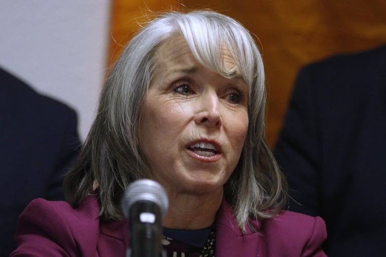 New Mexico Gov. Michelle Lujan Grisham speaks during a news conference, Tuesday, March 10, 2026, in Santa Fe, N.M., after signing legislation that bars federal immigration agents from election polling sites in New Mexico, in a step being considered by several other Democratic-led states. (AP Photo/Morgan Lee)
