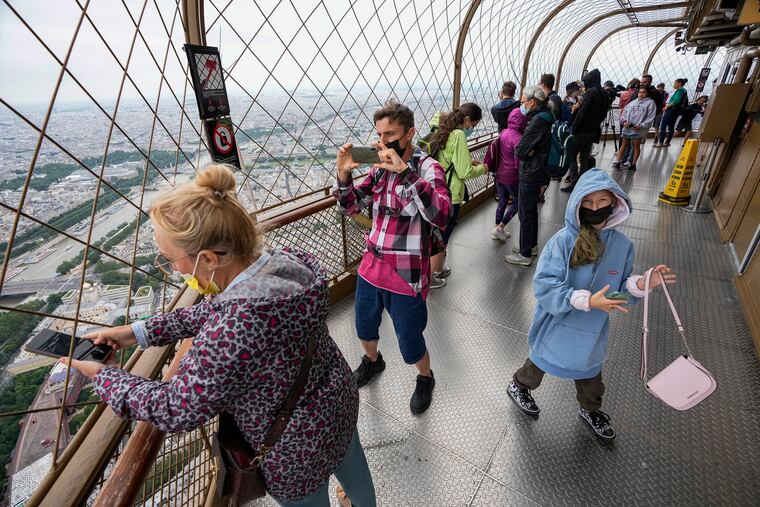 In this July 16 photo, visitors enjoyed the view from the top of the Eiffel Tower in Paris.