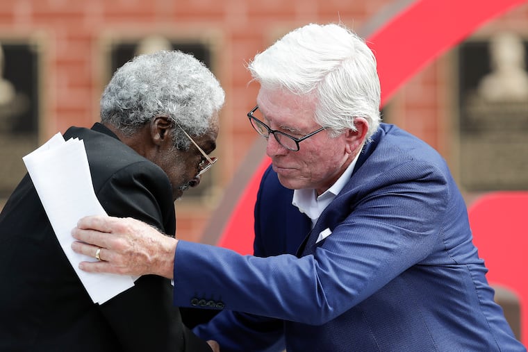Former Phillies Dick Allen and Mike Schmidt embrace during a ceremony retiring Allen's number 15 before the Phillies play the Washington Nationals on Thursday, Sept. 3, 2020. Schmidt hopes the late Allen will soon be joining him in Cooperstown as a member of the Baseball Hall of Fame.