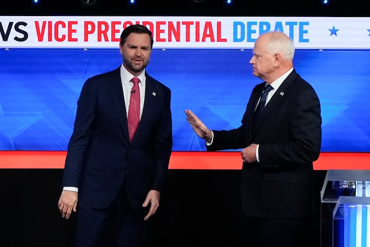 Republican vice presidential nominee Sen. JD Vance (R., Ohio) (left) and Democratic vice presidential nominee Minnesota Gov. Tim Walz at the vice presidential debate on Tuesday in New York.