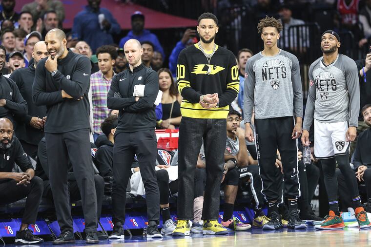 Nets Ben Simmons watches from the bench his game with the Sixers during the 1st quarter at the Wells Fargo Center in Philadelphia, Thursday, March 10, 2022.