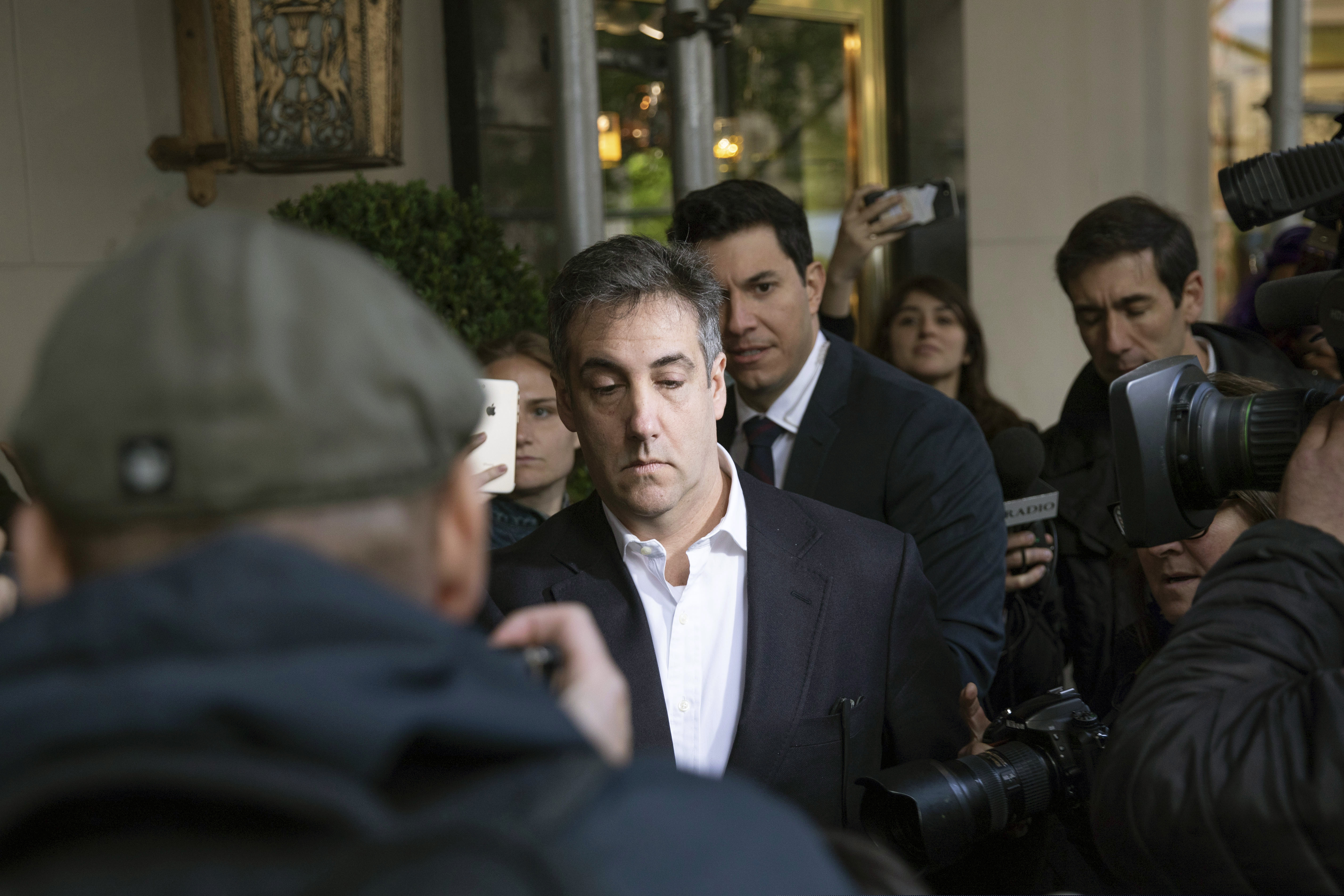 Michael Cohen, former attorney to President Donald Trump, leaves his apartment building before beginning his prison term Monday, May 6, 2019, in New York. Cohen will begin a three-year prison sentence for crimes including campaign finance violations related to hush-money payments made on Trump's behalf. (AP Photo/Kevin Hagen)