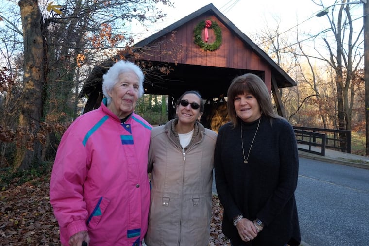 Sally Callaghan and her daughter Joanne Mitchell, and Mimi Cowperthwaite, of Cherry Hill, have decorated the Scarborough Covered Bridge with Christmas wreaths for years. Callaghan died on Saturday.