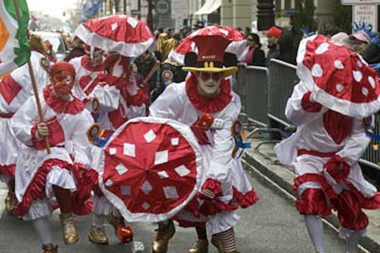Zack Kreschollek (center) of South Philly struts with the Holy Rollers comics near the front of the 2008 parade. (ED HILLE / Staff Photographer)