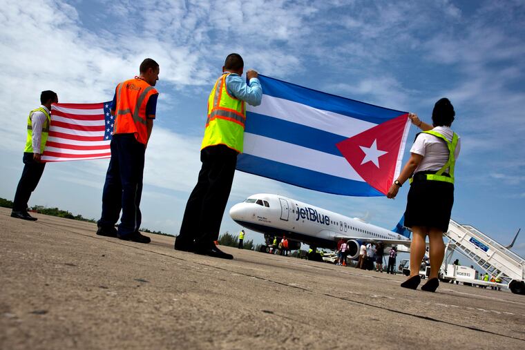 In this Aug. 31, 2016 file photo, airport workers receive JetBlue flight 387, the first commercial flight between the U.S. and Cuba in more than a half century.