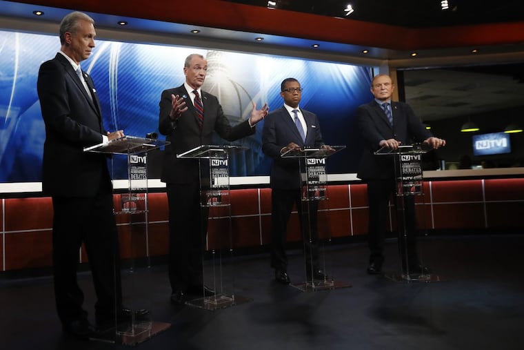 Candidates, from left, Assemblyman John Wisniewski, Phil Murphy, Jim Johnson and Sen. Ray Lesniak attend a Democratic gubernatorial primary debate in Newark, N.J.