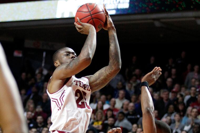 Quenton DeCosey, left, of Temple hits the game-winning shot with 3.1 seconds to go over Matt Williams of Central Florida to give Temple a 63-61 victory on Feb. 27, 2016, at Temple University's Liacouras Center. CHARLES FOX / Staff Photographer
