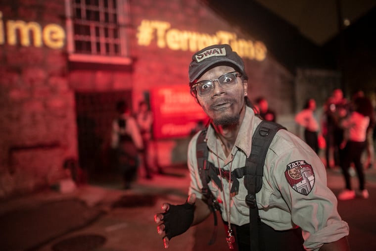 Mohamed Hassan, an actor on the SWAT team, does a choreographed dance at Eastern State Penitentiary. Eastern State Penitentiary acknowledges its Terror Behind The Walls attraction is historically inaccurate.