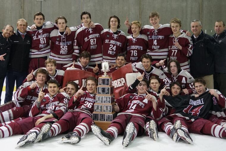 St. Joseph’s Prep celebrates beating Holy Ghost Prep for its first Flyers Cup championship.