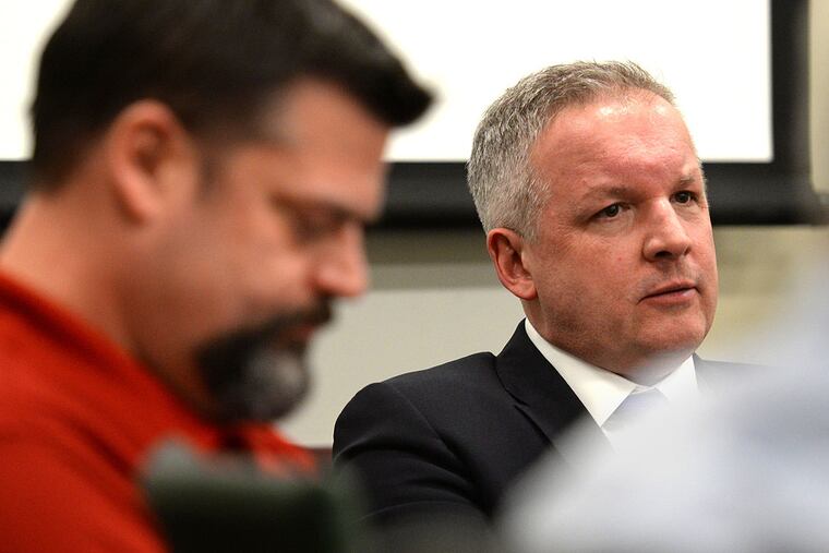 Secretary of the Moorestown Ethical Standards Board Scott Carew, left, and township solicitor Anthony Drollas Jr. at a recent meeting.