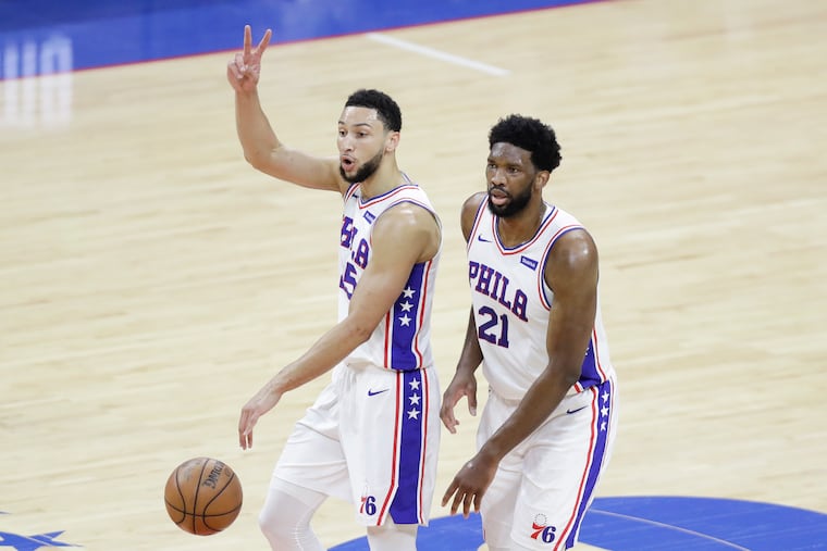 Sixers guard Ben Simmons walking up the court alongside center Joel Embiid against the Atlanta Hawks in Game 7 of the Eastern Conference semifinals on June 20 in Philadelphia.