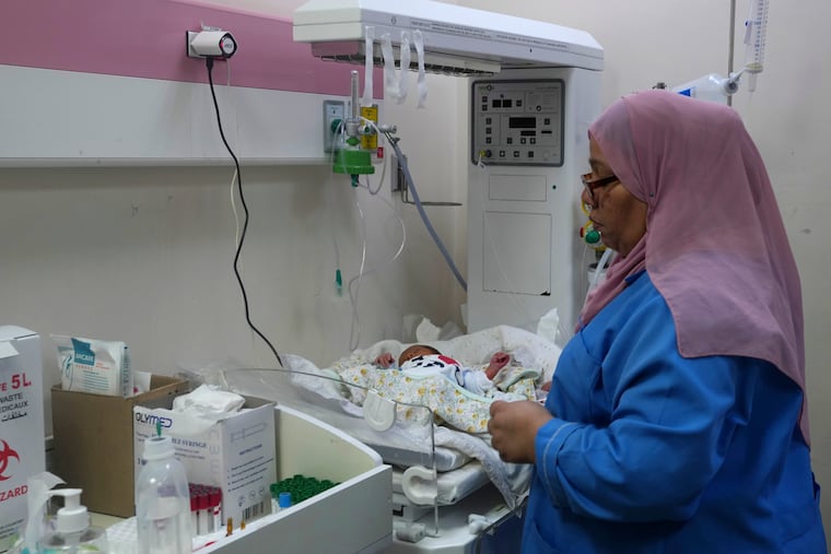 Palestinian doctors treat a prematurely born baby at Al Aqsa Hospital in Deir el-Balah, Gaza Strip, Sunday, Oct. 22, 2023.