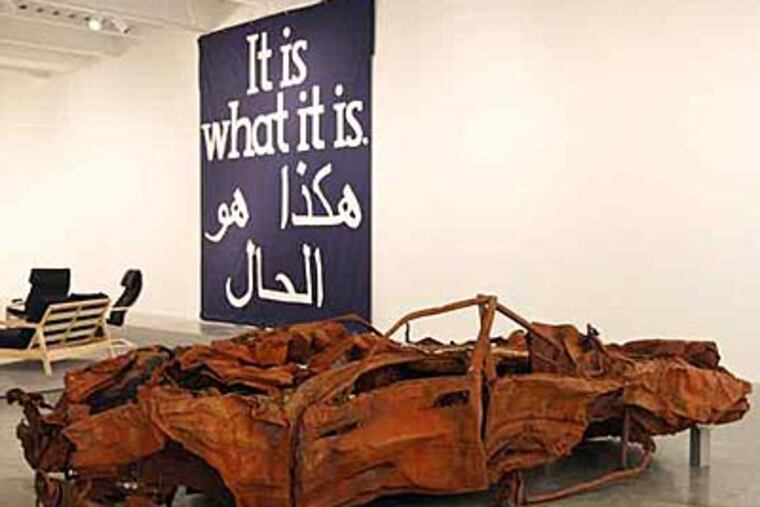A wrecked car exhibited by Jeremy Deller is part of "It Is What It Is," outside the Constitution Center from 10 a.m. to 4 p.m. today.