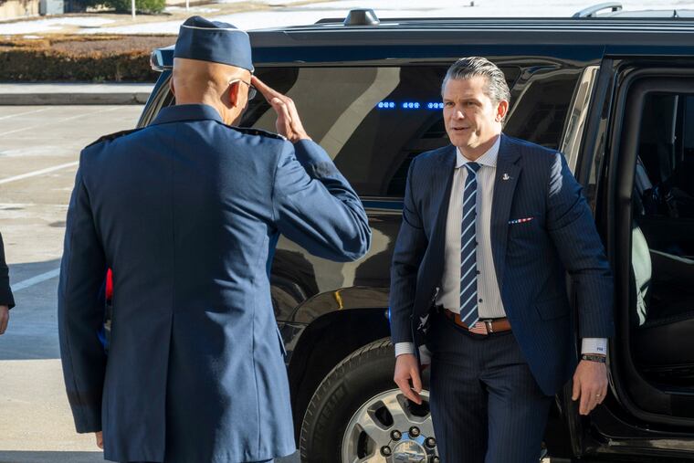 Defense Secretary Pete Hegseth (right) is welcomed to the Pentagon by Chairman of the Joint Chiefs of Staff Gen. Charles Q. Brown Jr. on Monday in Washington.