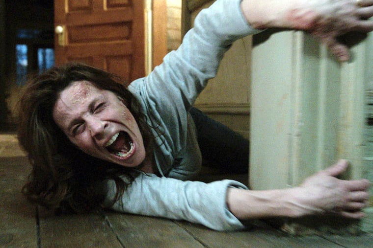 In this publicity image released by Warner Bros. Pictures, Lili Taylor portrays Carolyn Perron in a scene from "The Conjuring." (AP Photo/New Line Cinema/Warner Bros. Pictures)