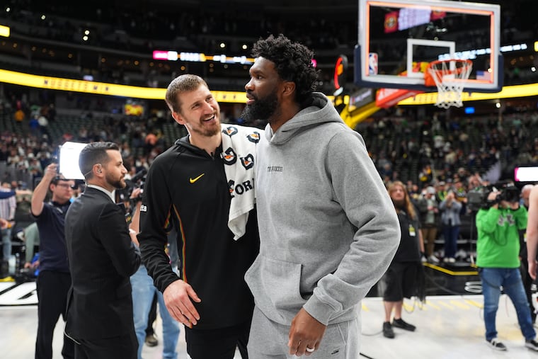 Fans were again deprived Tuesday of a matchup between the Nuggets' Nikola Jokić (left) and Joel Embiid, with the Sixers center out with an oblique strain.