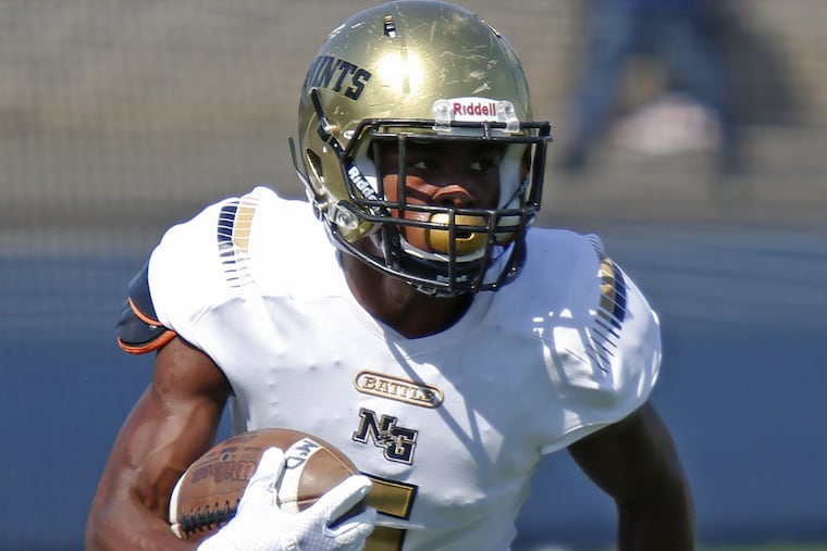 Tysheem Johnson of Neumann-Goretti returns a kickoff against Bishop McDevitt on Sept. 29, 2018.