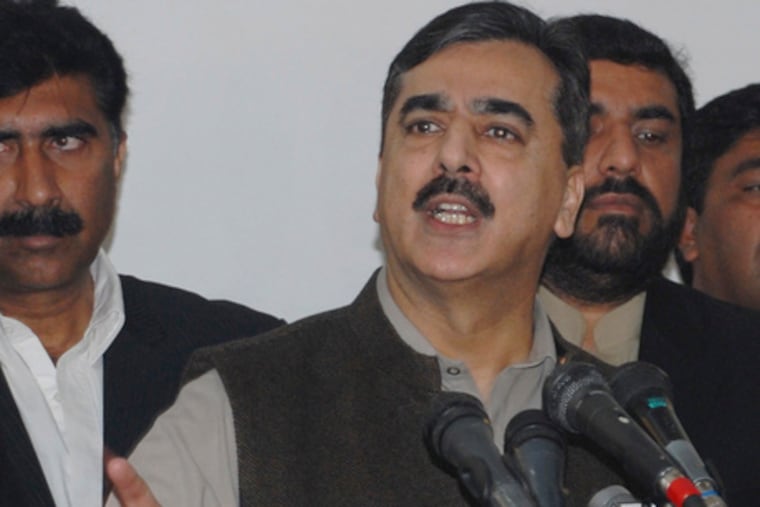 Pakistan's prime minister , Yousuf Raza Gilani, announces the arrest of a suspect in the Mumbai attack.