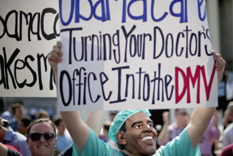 An opponent of President Barack Obama's health care law demonstrates outside the Supreme Court in Washington, Thursday, June 28, 2012, before the court's ruling on the law. (AP Photo/David Goldman)