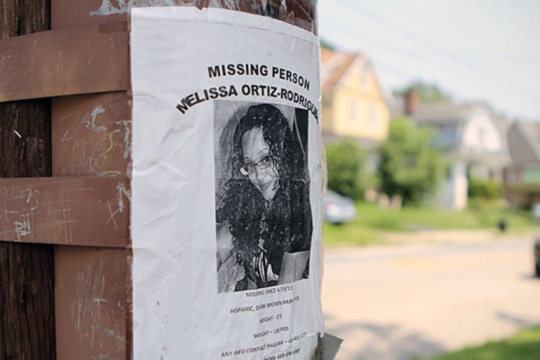 A missing poster faces the site police searched for the body of missing person Melissa Ortiz-Rodriguez, in Collingdale, on Tuesday, June 25, 2013. ( Stephanie Aaronson / Philly.com )