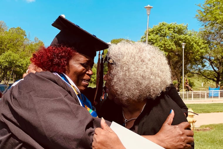 Rhonda Davis, a grandmother from North Philadelphia, was all smiles with her aunt Brenda Reed Saturday upon graduating from Cheyney University, where she was also valedictorian.