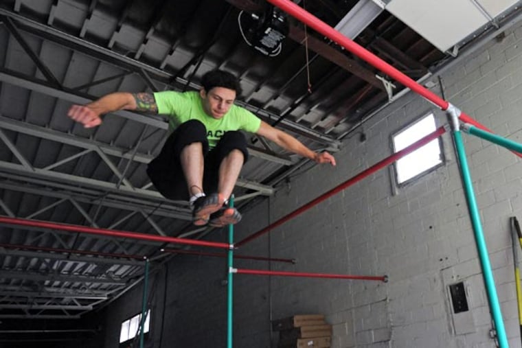 Jamie Rahn, an American Ninja Warrior contestant, at his Pinnacle Parkour Academy in Cherry Hill on Aug, 28, 2013. ( APRIL SAUL / Staff )
