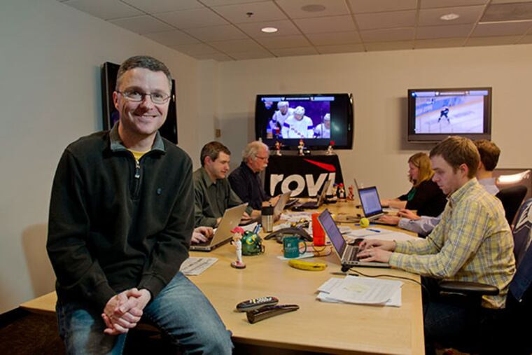 Stuart James, Manager of Content at Rovi Corporation, in Radnor, sits in a conference room with televisions and computers for editorial content writers about the Winter Olympics in Sochi. Rovi provides the entertainment information to clients in 55 countries world-wide. ( CLEM MURRAY / Staff Photographer )