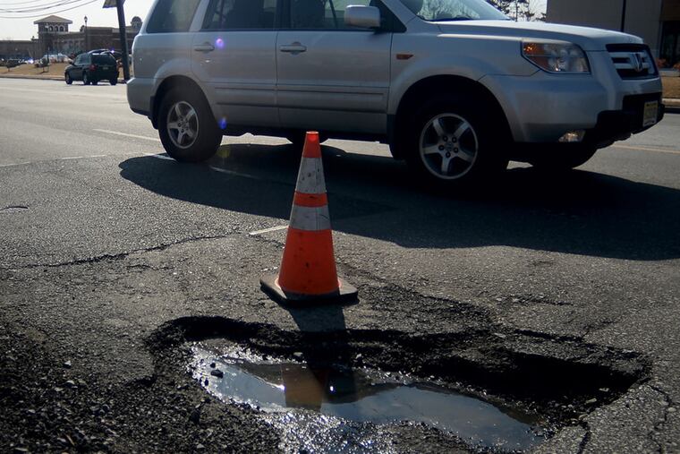 A pothole on Haddonfield Road in Cherry Hill March 9, 2015 (since filled). The thaw has arrived, and so has a harvest of road-bed canyons. The pothole virus has spread rapidly this week, and it's not going to get any better.