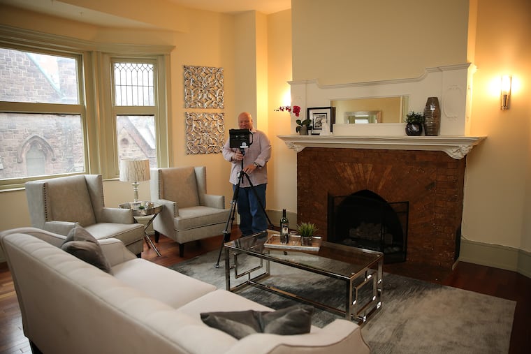 Photographer Michael J. Radie of Take the Tour Now of Gibbsboro, N.J., adjusts his Matterport virtual reality camera in a property in Philadelphia. Prospect home buyers use the videos.