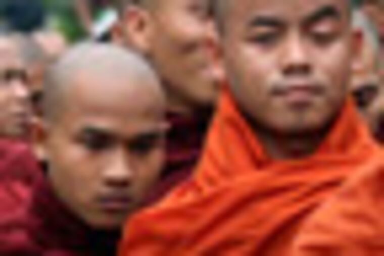 Myanmar Buddhist monks stage a rally to protest against ethnic minority Rohingya Muslims and to support Myanmar President Thein Sein's stance toward the sectarian violence that took place in June between ethnic Rakhine Buddhists and Rohingya Muslims in western Myanmar, in Mandalay, central Myanmar, on Sunday, Sept. 2, 2012. (AP Photo/Khin Maung Win)