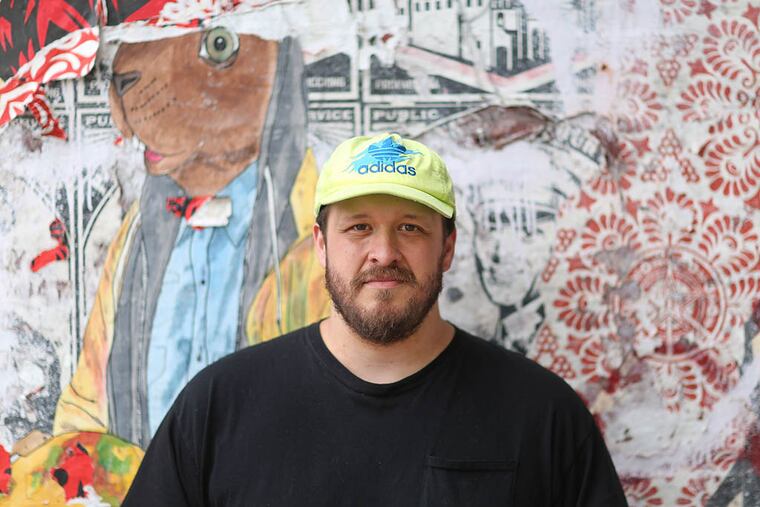 Brian Christinzio , in front of the Rocket Cat Cafe in Fishtown, is living in Gloucester County, where he grew up, in Wenonah. He will play Union Transfer on Tuesday and has a provisionally planned U.S. tour ahead of him. (DAVID SWANSON / Staff Photographer)
