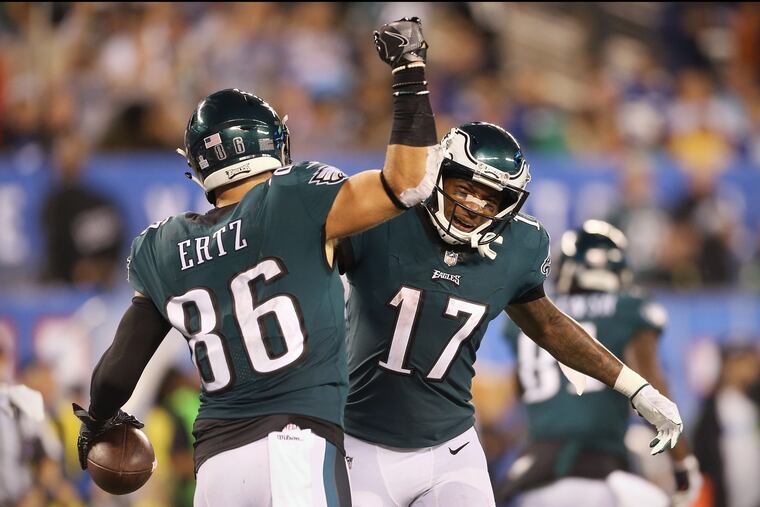 Alshon Jeffery and Zach Ertz (86) celebrate after Ertz scored a touchdown in the second quarter against the Giants.