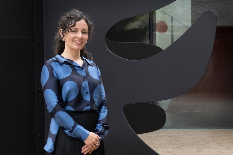 Juana Berrío, Senior Director of Programs at Calder Gardens, is photographed near "Tripes, by Alexander Calder on display at Calder Gardens Museum in Philadelphia.