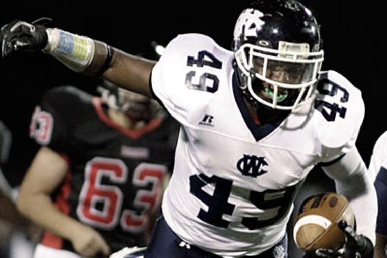 West Catholic's Tristin Freeman recovers a fumble before running it into the endzone for a touchdown. (Elizabeth Robertson/Staff Photographer)