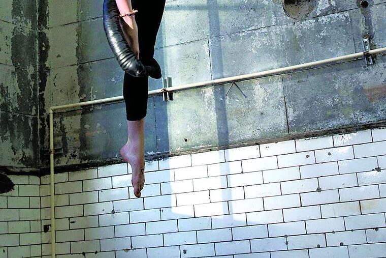 Students at Iron City Circus Arts, such as Bridget Re, learn trapeze and rope exercises.