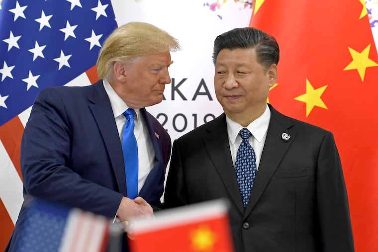 U.S. President Donald Trump (left) shakes hands with Chinese President Xi Jinping during a meeting on the sidelines of the G-20 summit in Osaka, western Japan on June 29, 2019.