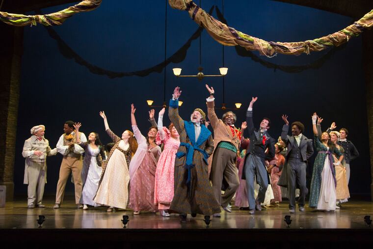 Greg Wood (center) and the cast of "A Christmas Carol" at McCarter Theatre, through Dec. 31.