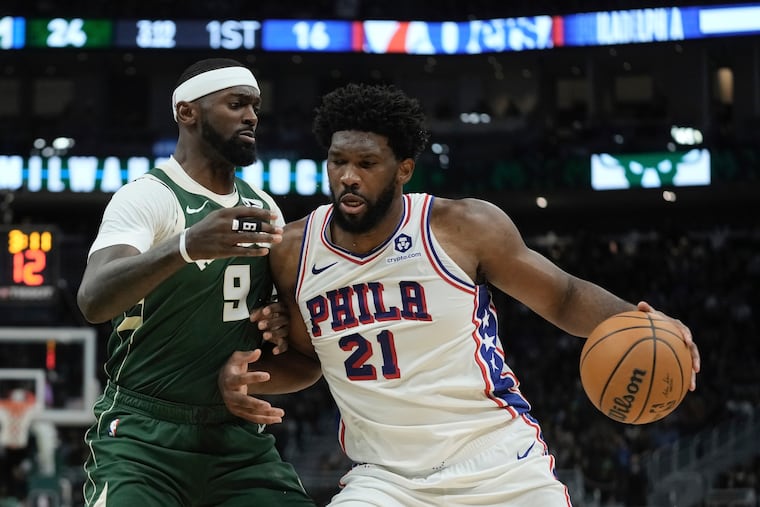 Philadelphia 76ers' Joel Embiid tries to get past Milwaukee Bucks' Bobby Portis during the first half of an NBA basketball game Thursday, Oct. 26, 2023, in Milwaukee. (AP Photo/Morry Gash)