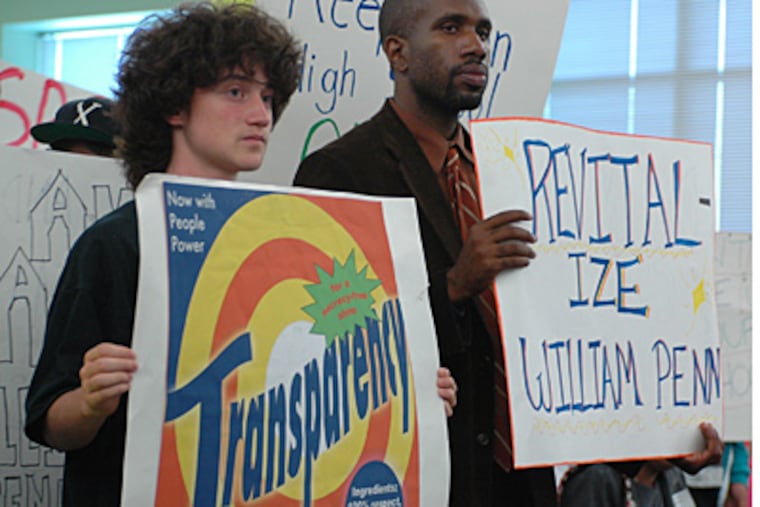 Protesters push to keep William Penn High open during Wednesday's School Reform Commission meeting. (James Heaney / Staff)