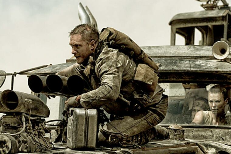 Drive, he said: Tom Hardy, with Charlize Theron at the wheel in "Mad Max: Fury Road." (Jasin Boland / Warner Bros. Pictures)