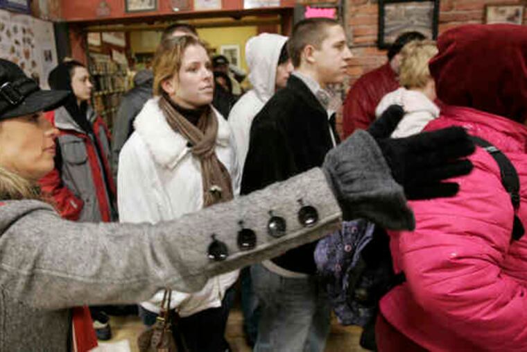 Sylvia McCoy (left) leads a Pittsburgh tour. She started a business specializing in food-theme tours after her husband lost his job.