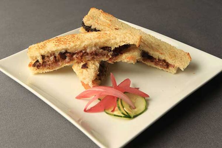 A highlight at Caleb’s American Kitchen: Grilled cheese updated with shreds of tender braised short rib.
