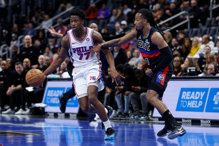 VJ Edgecombe dribbles past Detroit Pistons guard Daniss Jenkins at Little Caesars Arena on Friday.
