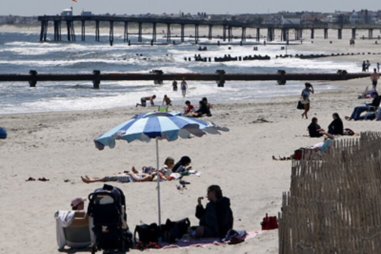 Beach scenes like this one on Ocean City have been in short supply with all the rainy weather the region has endured in the past month. With the official start of summer finally here, sunnier days could be on tap. (David Maialetti / Staff Photographer)