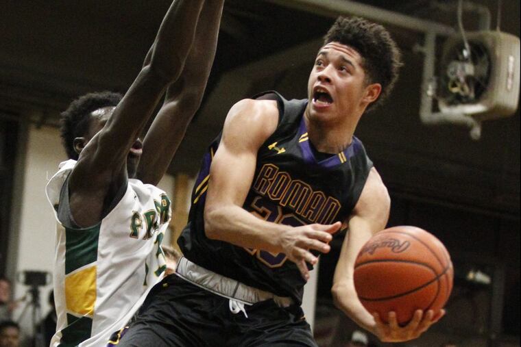 Roman Catholics Seth Lundy (right) goes around Bonner-Prendergasts Ajiri Johnson in a Catholic League game last season.