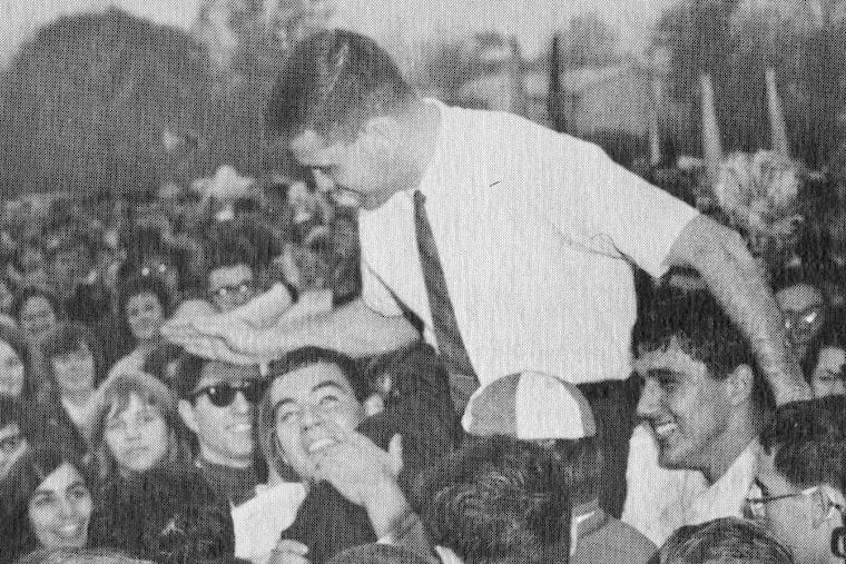 Jim Delaney getting carried off the field by his Camden Catholic players.