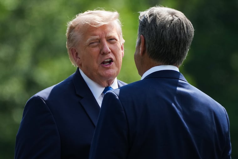 President Donald Trump (left) and CIA Director John Ratcliffe speak as they depart following a cabinet meeting at Camp David, near Thurmont, Md., Friday, July 31, 2026.